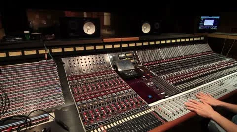 Recording Studio engineer mixing on big board Stock Footage
