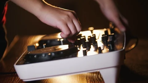 Recording studio s audio console and a hand pulling up the knobs 스톡 동영상 96210563