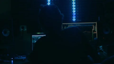 Recording studio. Sound engineer working at the computer monitor editing sounds Video stock 143723708