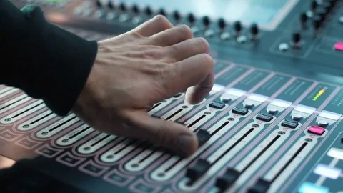 Recording studios audio console and knob. Sound producer records a musician Stock Footage 76926655
