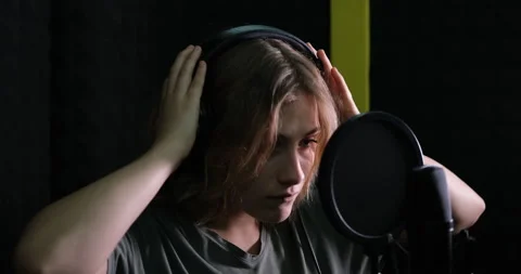 Recording a track in a professional recording studio Stock Footage 149085893