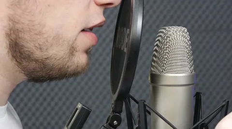 Recording a vocalist in a recording Studio Stock Footage 64274879
