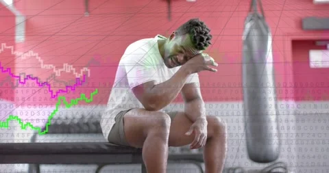 Recovering after set, man in white T-shirt, gray shorts wiping sweat on gym Stock Footage 331002287