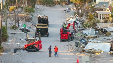Recovery crew picking trash from damaged houses after hurricane Milton storm Stock Footage 304828869