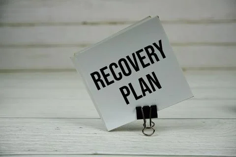 Recovery Plan text message write on sticky note on wooden background Stock Photos