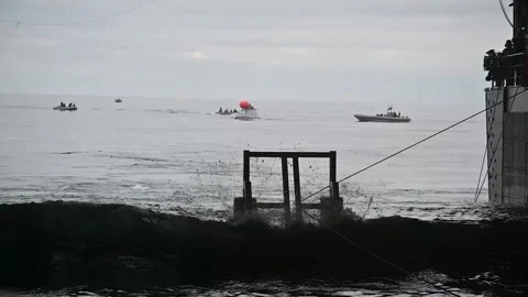 Recovery teams arrive at splashdown site of Artemis I Orion Spacecraft Stock Footage 271542108