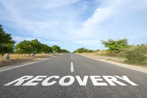 'Recovery' text on the asphalt road Stock Photos