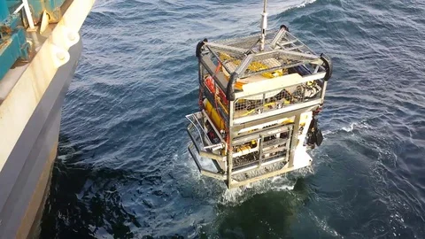 Recovery underwater robot from the seabed during a big wave Stock Footage
