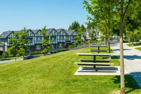 Recreation area with chess table on the block of new townhouses. Stock Photos