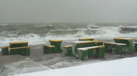 Recreation area on the seafront during a snowfall and storm. Slow motion. Stock Footage 65298996