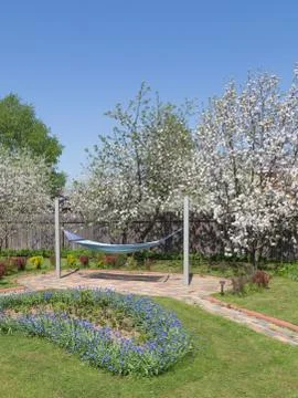 Recreation area in the spring garden Stock Photos