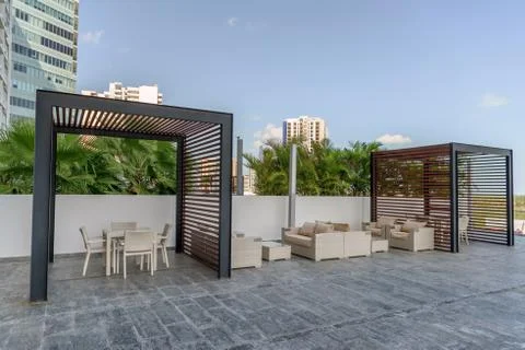 Recreation area with white sofas against the backdrop Stock Photos