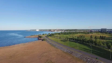 Recreation park with asphalt paths along the sandy beach sea shore Stock Footage 82808628