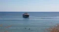 Recreation ship coming out from lagoon of Coal Bay in Mediterranean sea, Cyprus HD Footage