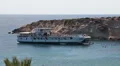 Recreation ship in lagoon of Coal Bay with swimming peopel in Paphos, Cyprus HD Footage