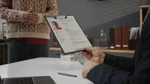 Recruitment Manager Getting Application Form from Young Job Candidate Stock Footage 330517732