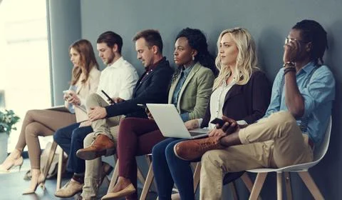Recruitment, queue and people with technology in waiting room, interview pr.. Stock Photos