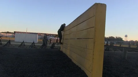 Recruits receive instructions from their instructors about obstacle course -2016 Video stock 88629386