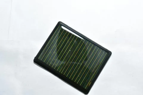 Rectangle 6 volt solar panel with yellow and black wire isolated on white Stock Photos