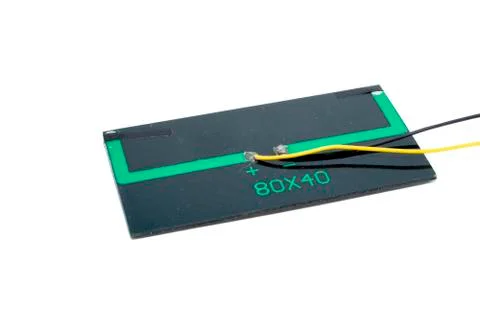 Rectangle 6 volt solar panel with yellow and black wire isolated on white Stock Photos