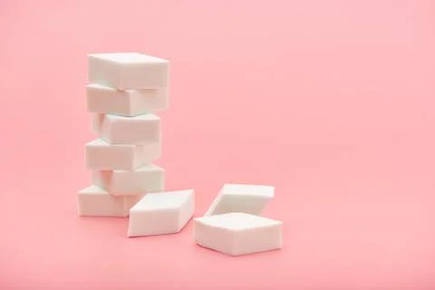 Rectangle cosmetic white sponge in hands on pink background, copy space, beauty Stock Photos