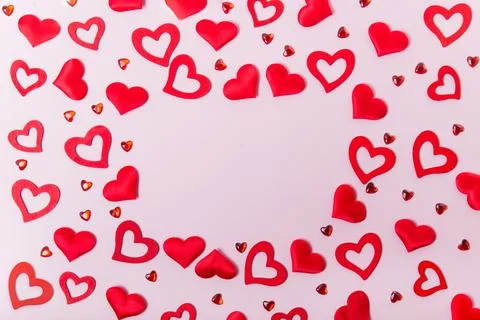 Rectangle frame made of various types of hearts on the pink background Stock Photos
