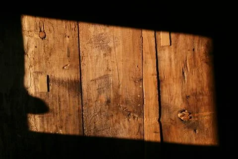 A rectangle shape of sunlight on a wooden structure, close-up Stock Photos