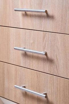 Rectangle shaped kitchen cabinet with stainless steel brushed handles close u Stock Photos