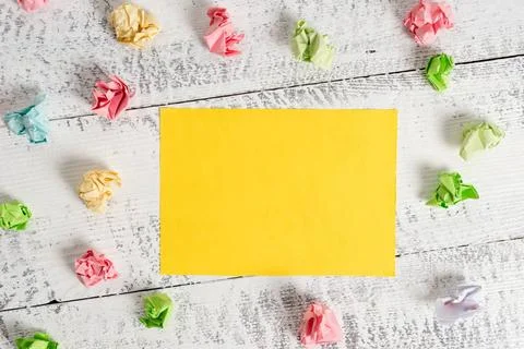 Rectangle square shaped colored paper in a white wood background. Colorful... Stock Photos