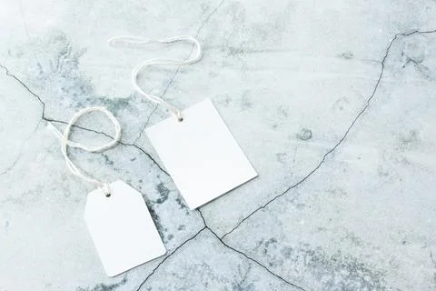 Rectangle tag mockup, square tag mockup with white cord on concrete background Stock Photos