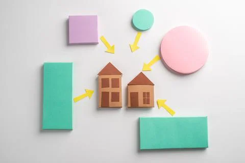 Rectangles and circles with pointing arrows at two houses Stock Photos