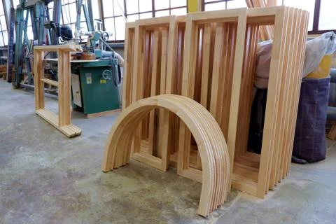Rectangular and arched glued parts of wooden pine windows Stock Photos