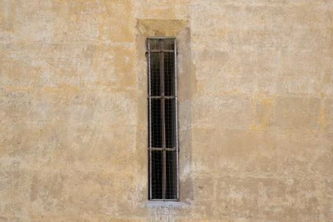 Rectangular aperture in old stone building facade Stock Photos