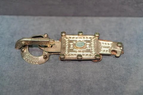 A rectangular artifact with loops, possibly a necklace or decorative elemen.. Stock Photos