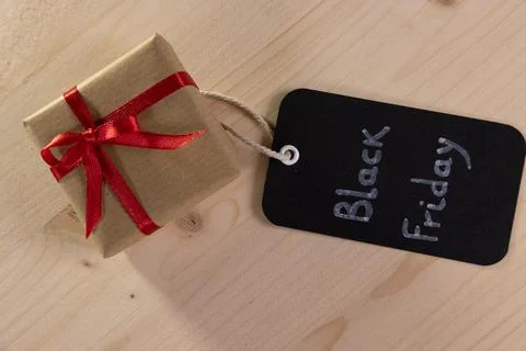 A rectangular black label bearing the words Black Friday alongside a small .. 库存照片