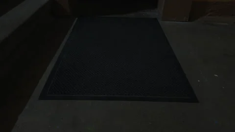 Rectangular black rug on concrete flooring near an elevator 動画素材 275428618