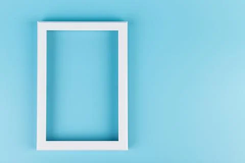 Rectangular blank white picture frame on the blue  background. mockup 스톡 사진