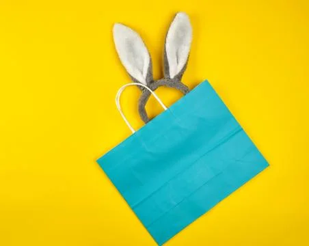 Rectangular blue paper shopping bag with a white handle Stock Photos