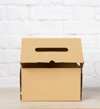 Rectangular box made of brown corrugated cardboard Stock Photos