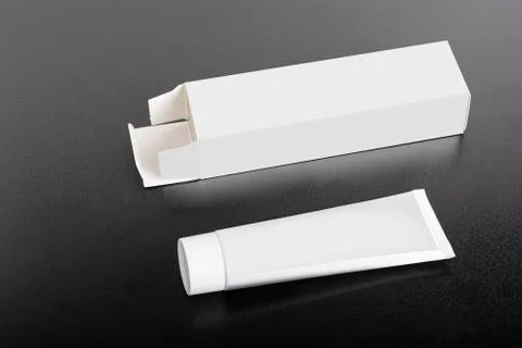 Rectangular box package mockup with tube on ground mock-up series Stock Photos