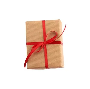 Rectangular box wrapped in brown paper and tied with a red bow, Stockfoto's