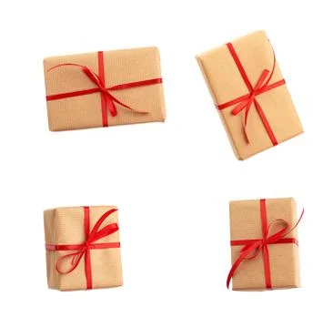Rectangular box wrapped in brown paper and tied with a red bow Stock Photos