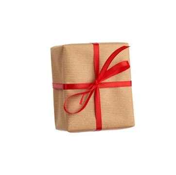 Rectangular box wrapped in brown paper and tied with a red bow, gift isolated Stock Photos