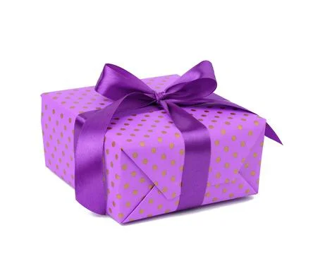 Rectangular box wrapped in purple polka dot paper and tied with a silk ribbon Stock Photos
