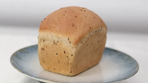 Rectangular bread swirls on a plate. Close-up slider shot of freshly baked 스톡 동영상 307591172