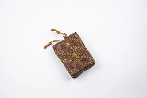 A rectangular brown tissue sac with the ornament. Stock Photos