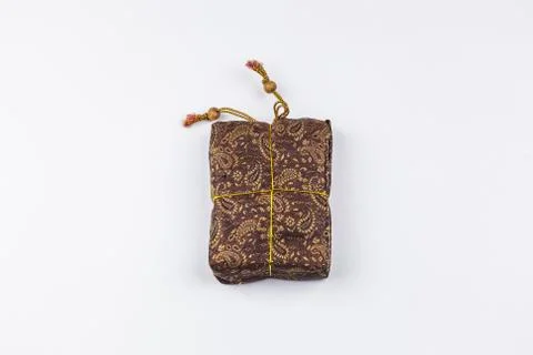 A rectangular brown tissue sac with the ornament. Stock Photos