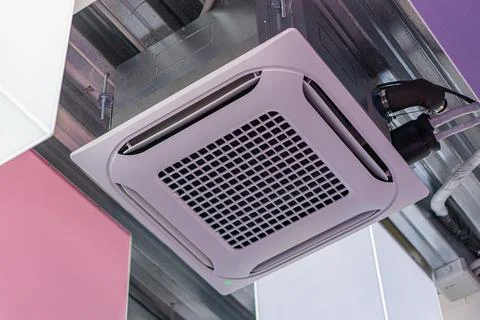 Rectangular ceiling-mounted air conditioning unit with vent pattern, attached Stock Photos