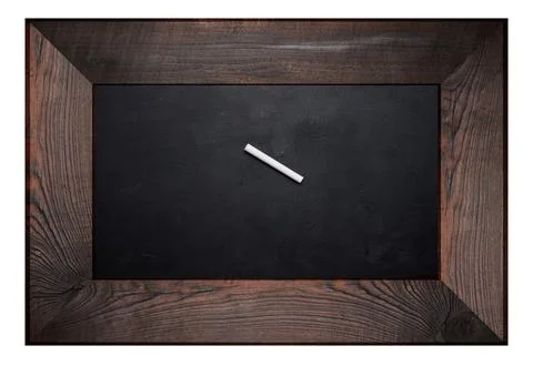 Rectangular chalk board in a wooden brown frame and a piece of white chalk .. Stock Photos