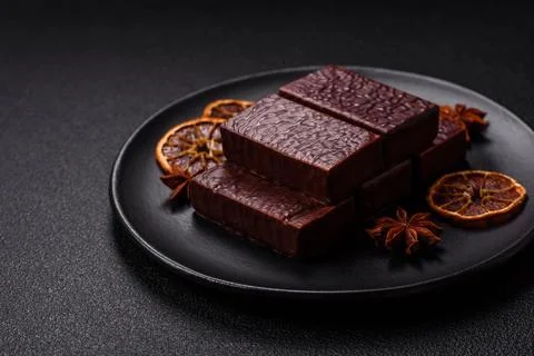 Rectangular chocolate candies with mousse and waffles Stock Photos